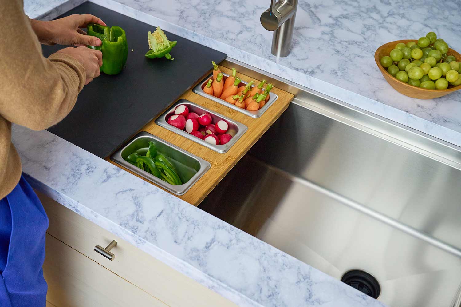 46 inch stainless steel undermount kitchen sink. Large single bowl trough sink with workstation accessories and dual tiers.