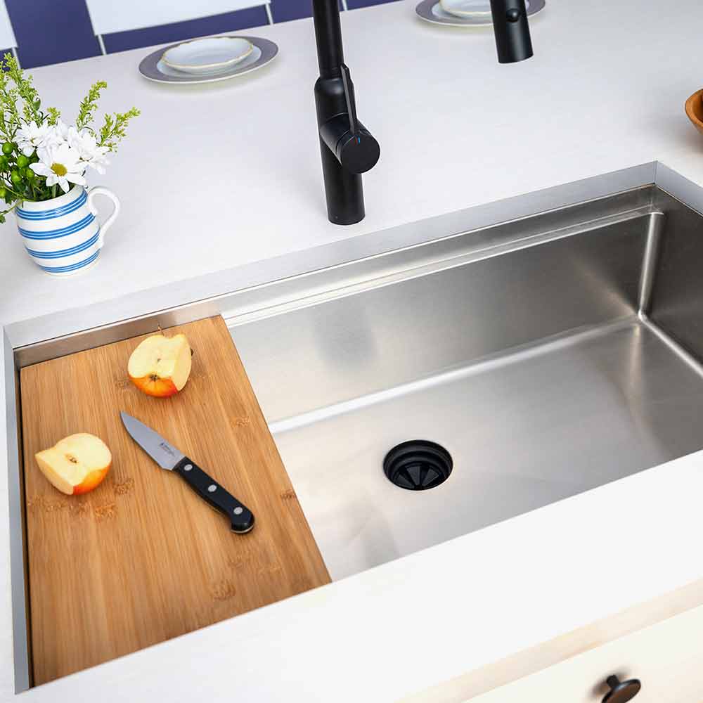 Modern 33-inch workstation sink with bamboo cutting board and center drain. Stainless steel single bowl undermount design for versatile kitchen use.