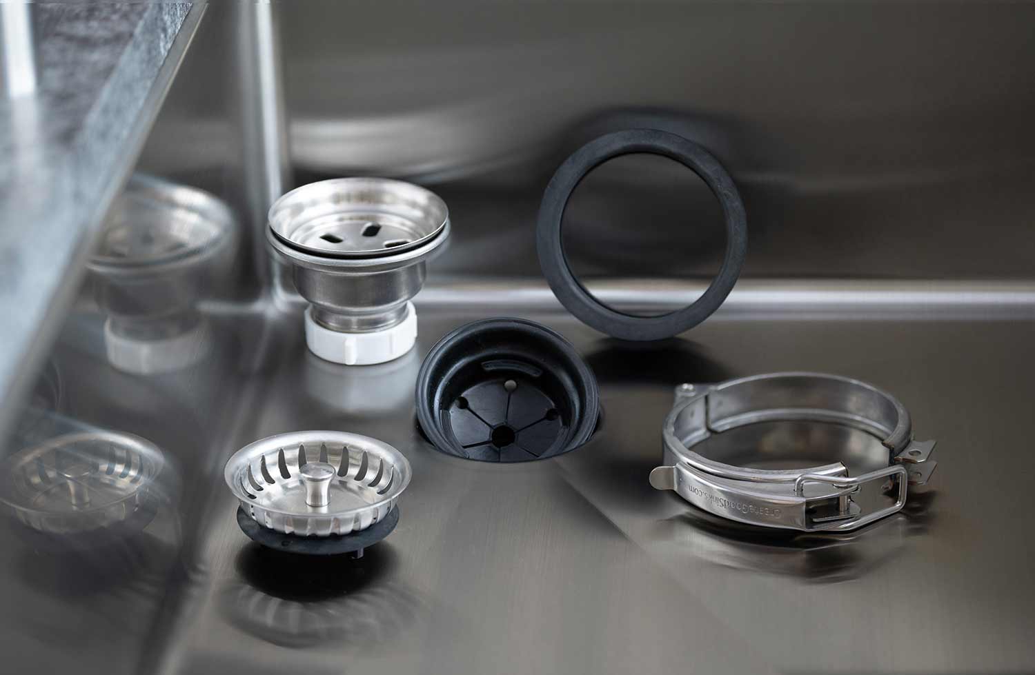 Premium Seamless Drain and Disposal Kit components displayed in a stainless steel sink, ensuring a secure and efficient drainage system.