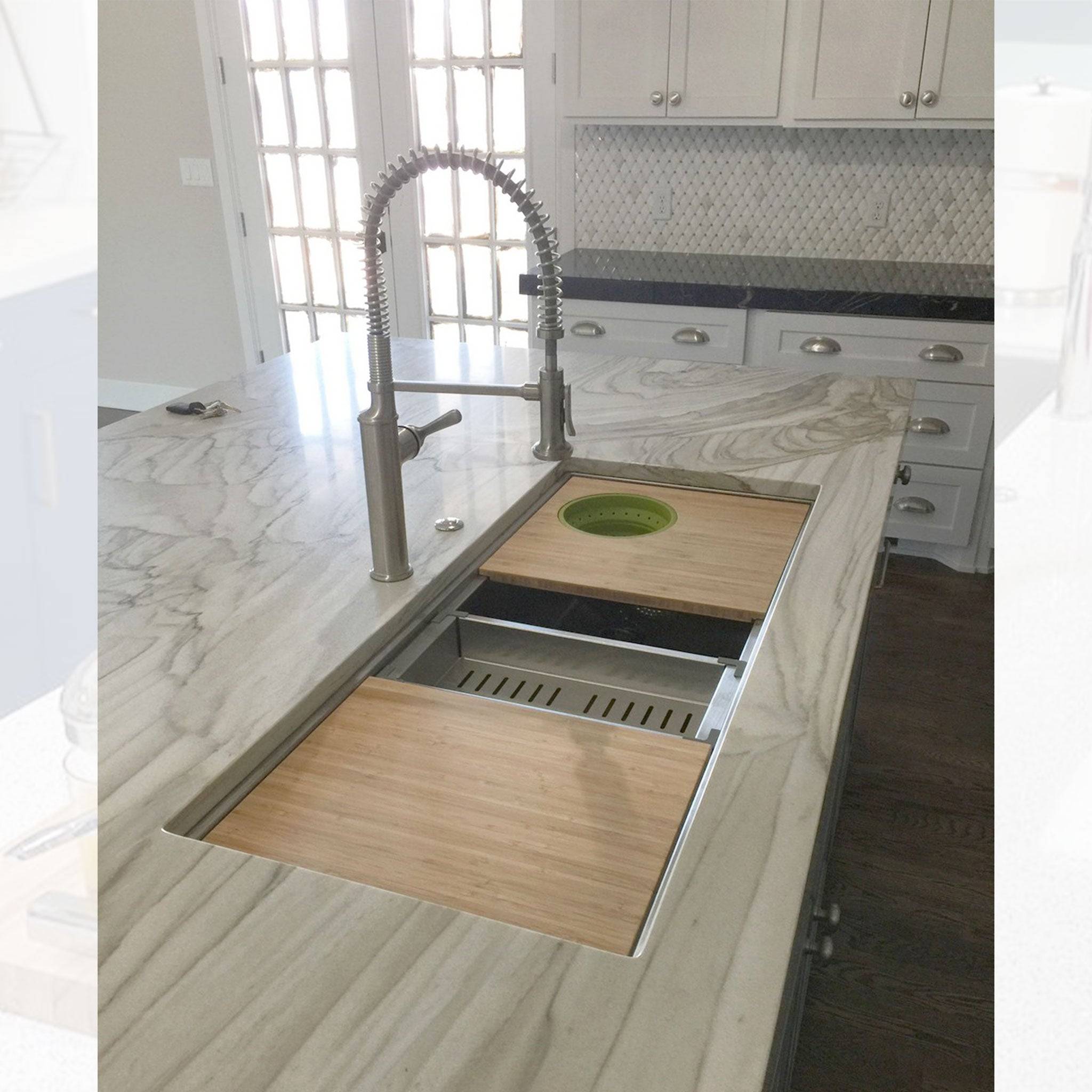 Luxury kitchen island with a 46-inch double bowl workstation sink, featuring bamboo cutting boards and a drying rack for enhanced usability.