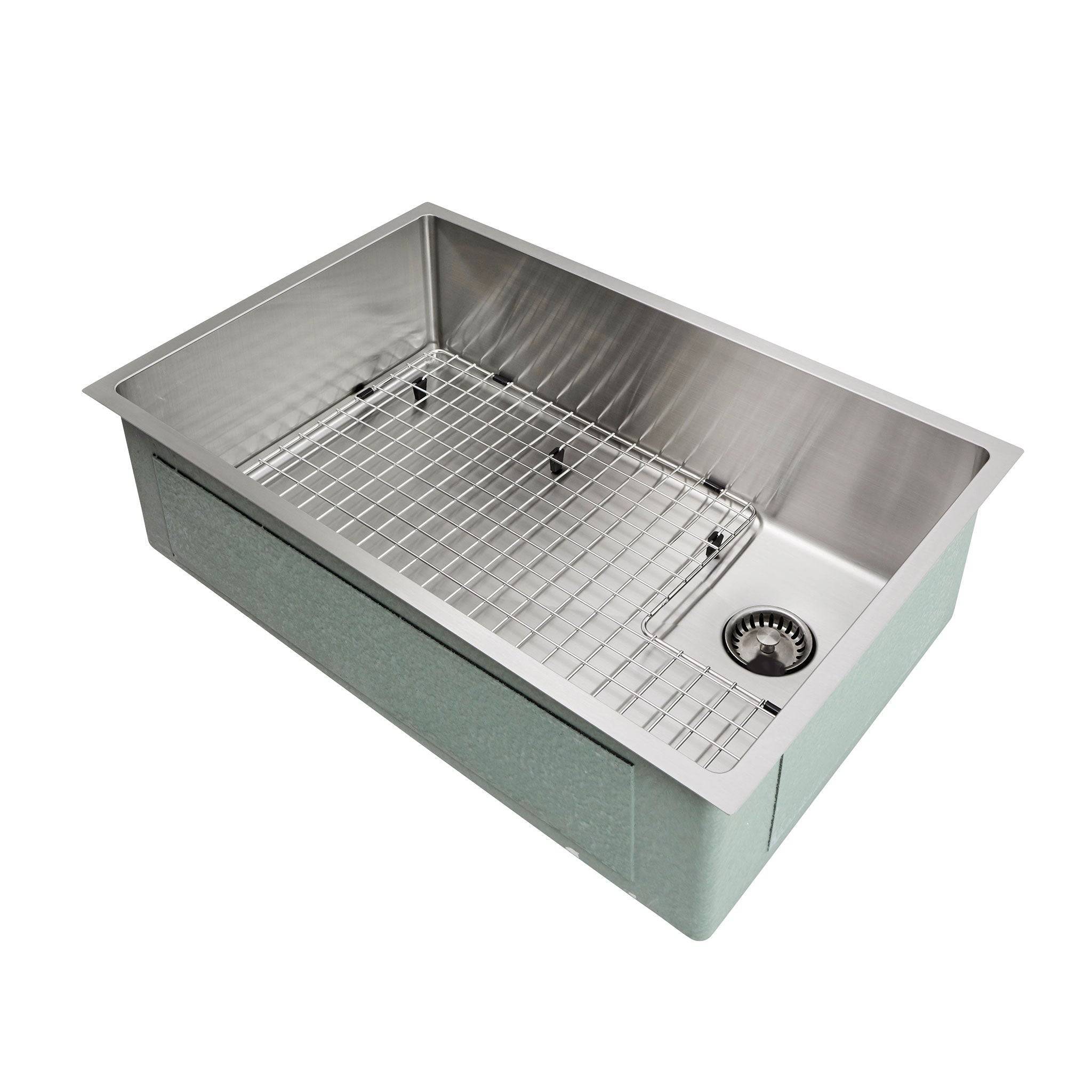 28-inch stainless steel undermount kitchen sink with protective grid and offset right drain, designed for durability and modern kitchen remodels.