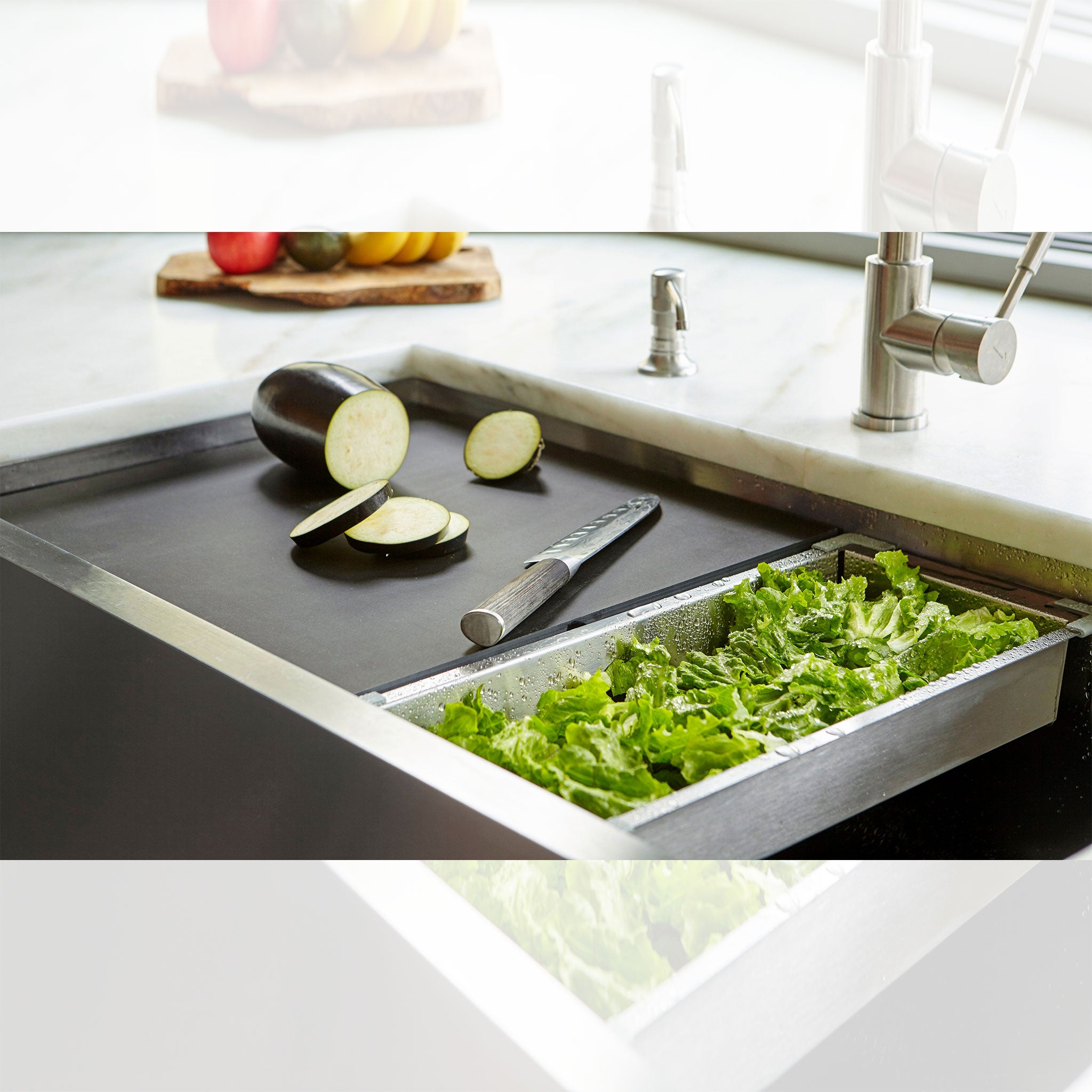 The 18”, black, dishwasher safe cutting board and stainless steel colander from Create Good Sinks.