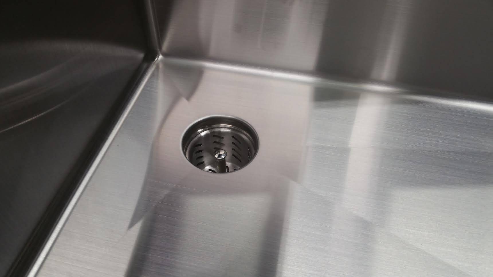 Top view of Seamless Composting Deep Drain Kit in a stainless steel sink, showcasing its sleek design and effective drainage system.