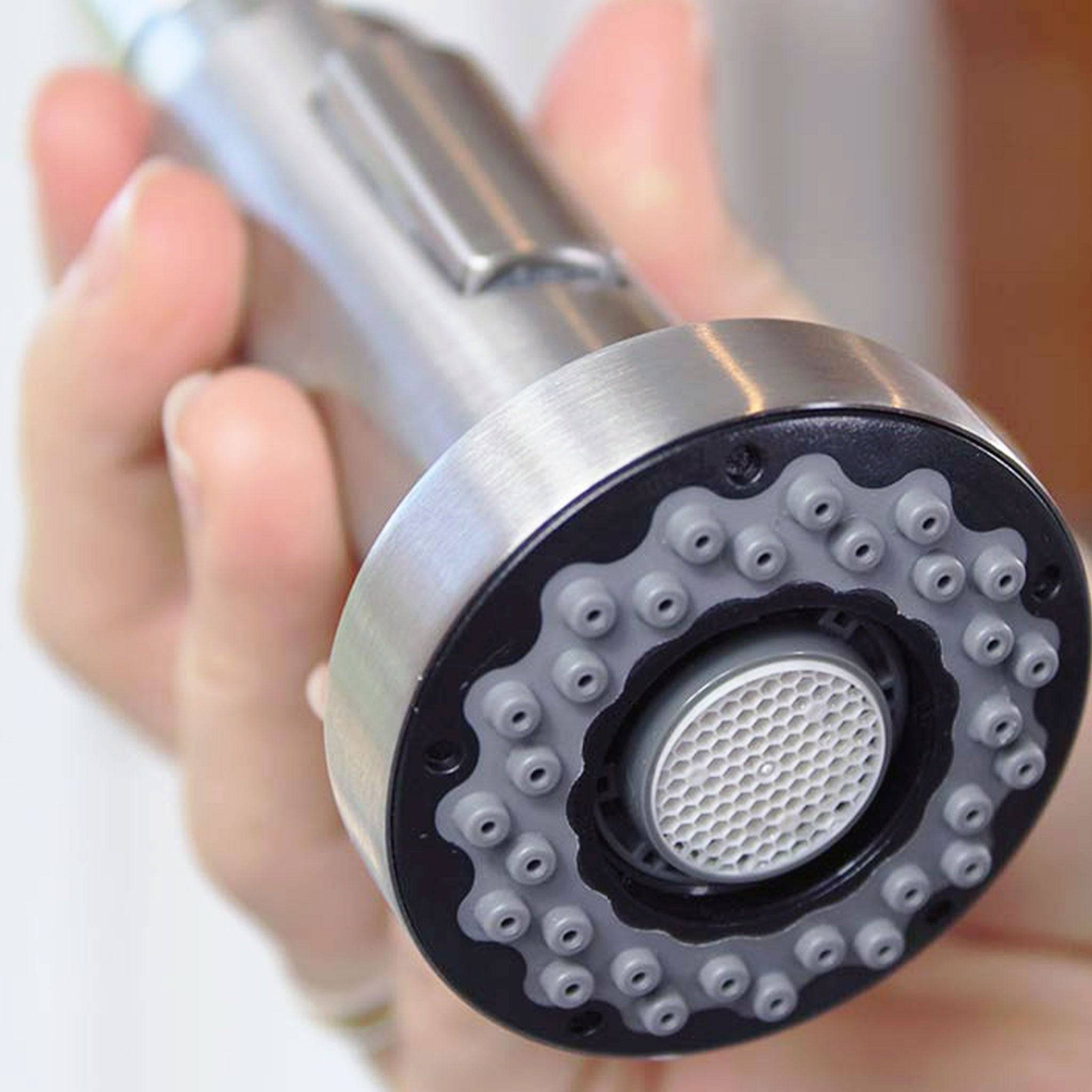 Close-up of the Jerry kitchen faucet spray head, showcasing its stainless steel finish and multiple nozzles for efficient water flow.