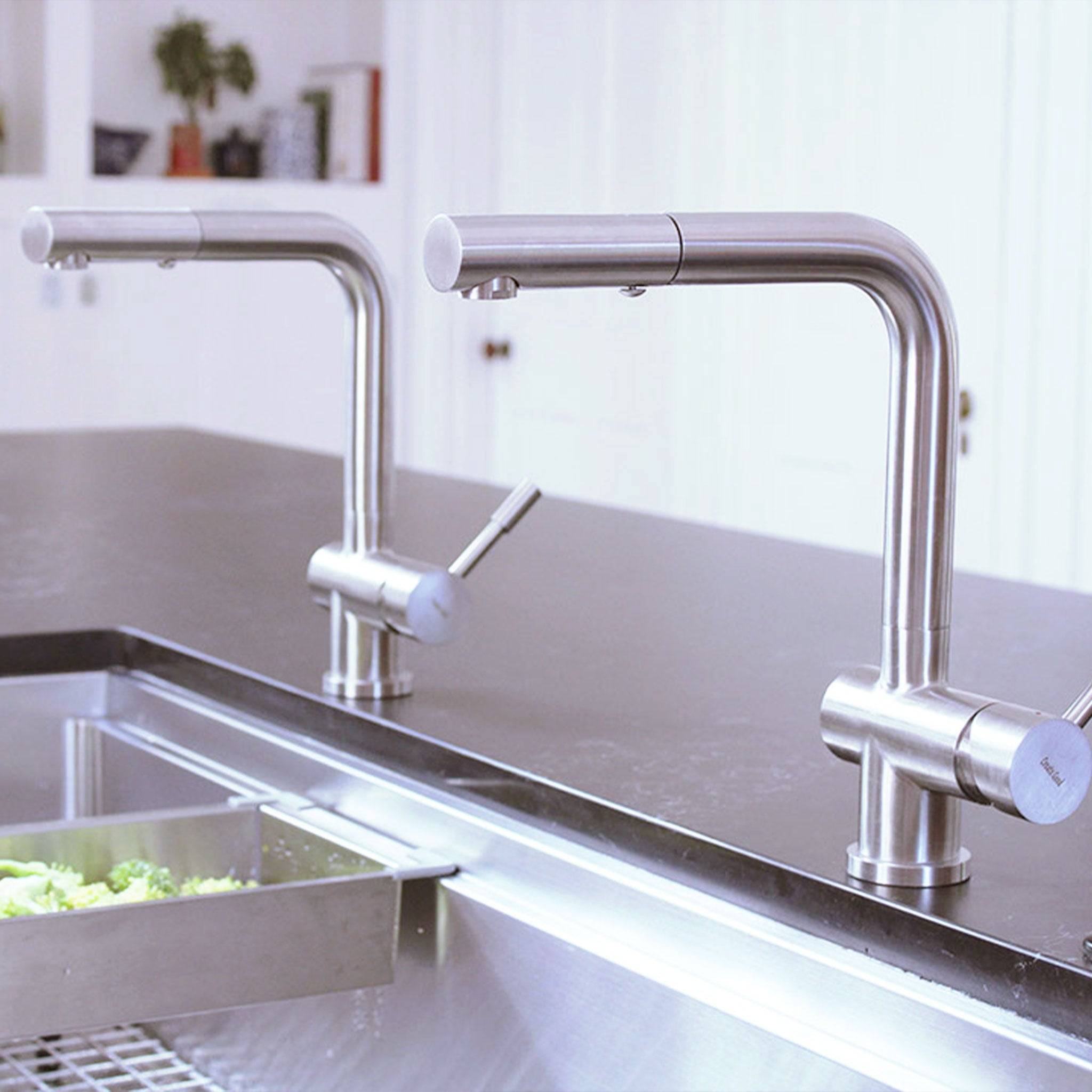 Ardell Stainless Steel Kitchen Faucet with a sleek, minimalist design installed on a modern kitchen sink. Features a pull-out spout for convenience.