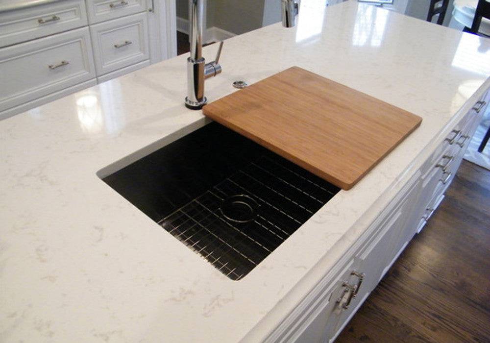 Classic Sink Accessory - 17" Bamboo Cutting Board (CB17) placed over a modern kitchen sink. Durable and stylish, perfect for food prep.
