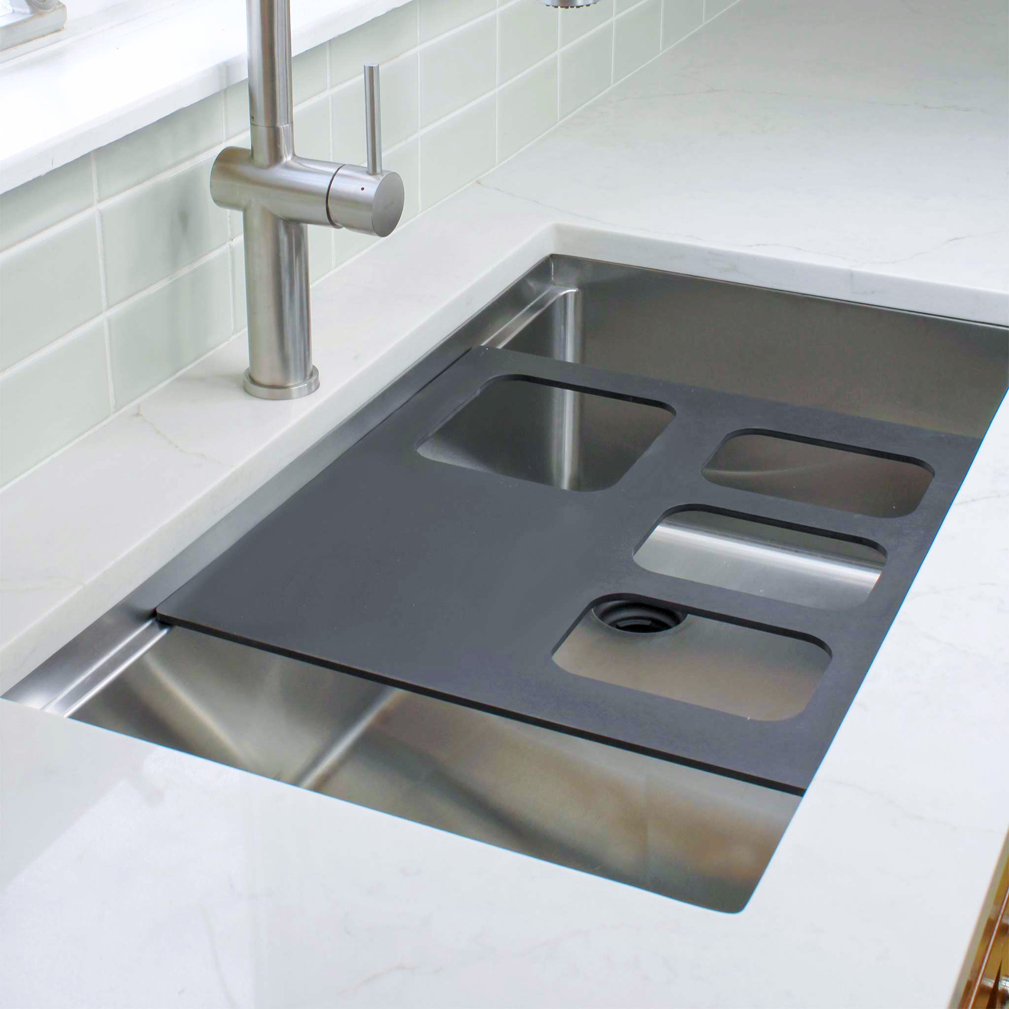Create Good Sinks’ Black, 4 Bowl Serving Board for a Workstation Kitchen Sink.