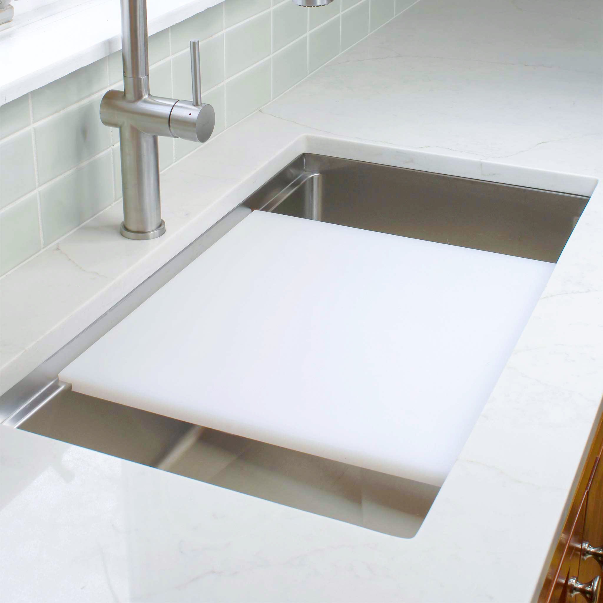 18 inch dishwasher safe white cutting board on workstation sink from Create Good Sinks