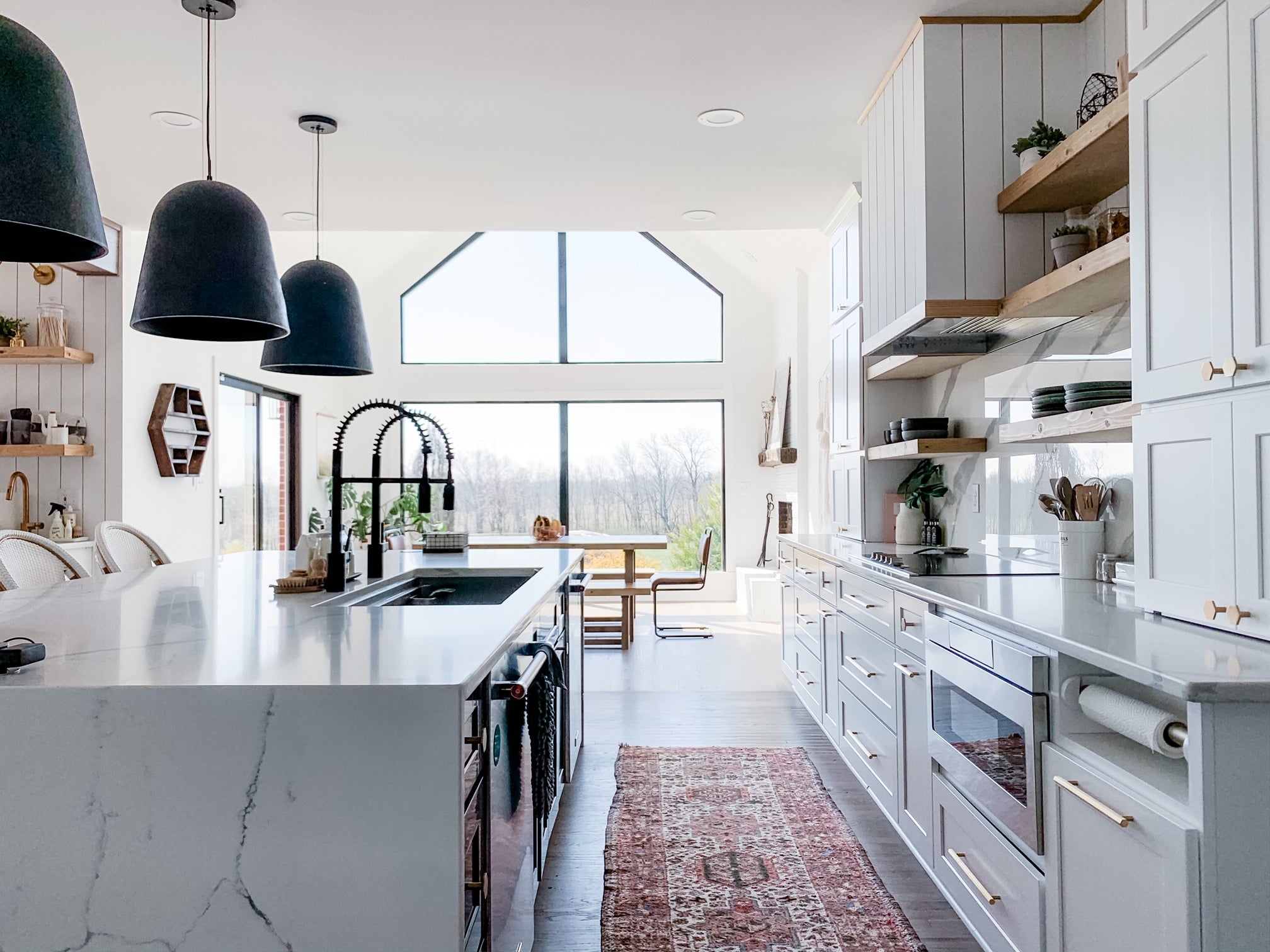 Bohemian minimalist kitchen with four foot workstation sink