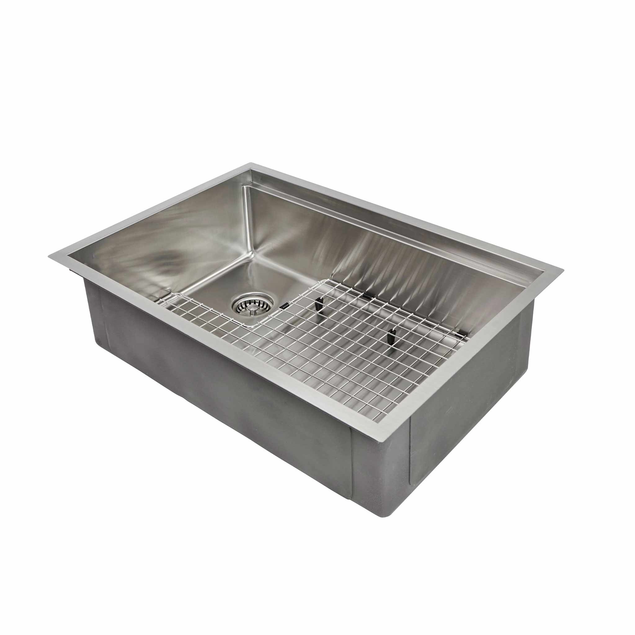 28 inch workstation sink with stainless steel sink grid and a left, offset drain and seamless drain design.