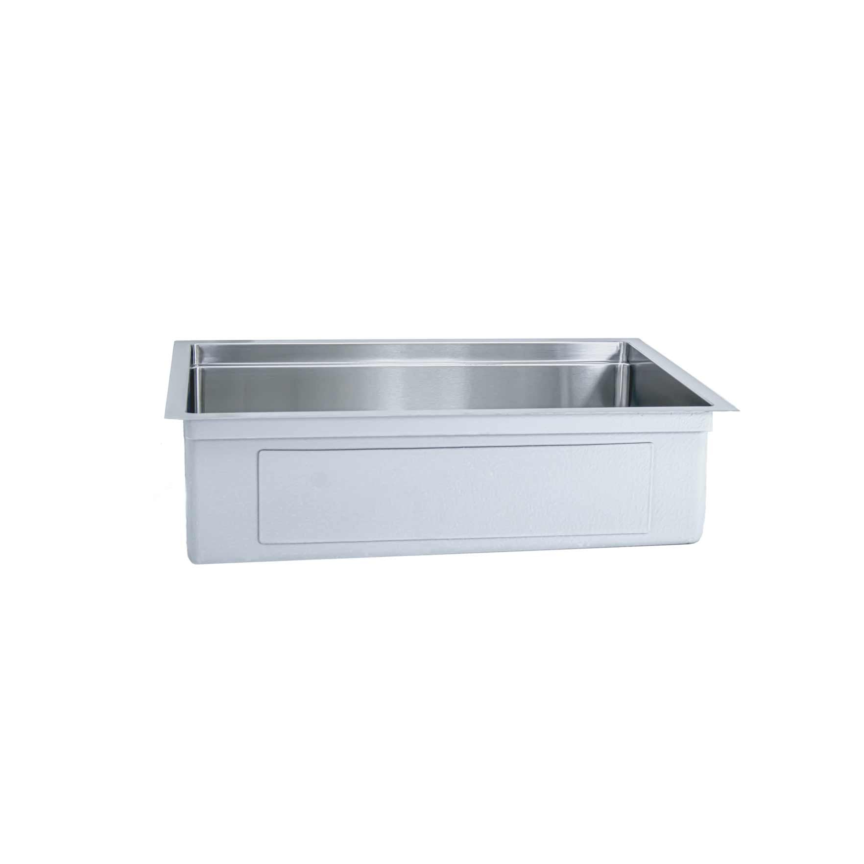 Side view of exterior 28 inch stainless steel undermount workstation sink with eight inch depth and reversible seamless drain