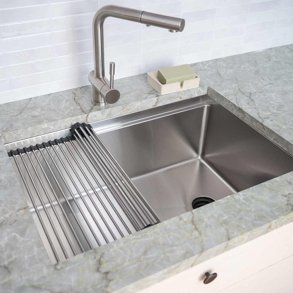 Stainless steel workstation kitchen sink with a roll-up drying rack and undermount installation, designed for efficiency and style in contemporary kitchens.