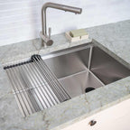 Stainless steel workstation kitchen sink with a roll-up drying rack and undermount installation, designed for efficiency and style in contemporary kitchens.