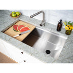 40-inch stainless steel workstation sink with a built-in ledge, featuring a cutting board and fresh watermelon for convenient food prep.