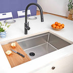 33-inch stainless steel workstation sink with bamboo cutting board. Single bowl undermount design enhances kitchen prep and workflow efficiency.