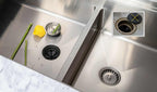 Modern kitchen sink featuring a Seamless Drain and Disposal Kit with a strainer basket and splash guard for efficient waste disposal.