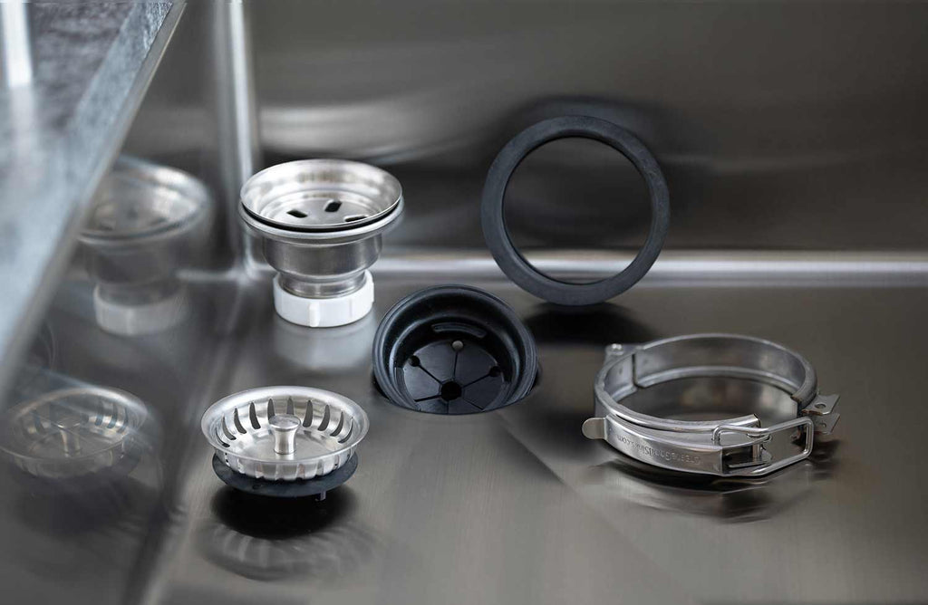 Premium Seamless Drain and Disposal Kit components displayed in a stainless steel sink, ensuring a secure and efficient drainage system.