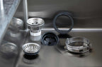 Premium Seamless Drain and Disposal Kit components displayed in a stainless steel sink, ensuring a secure and efficient drainage system.