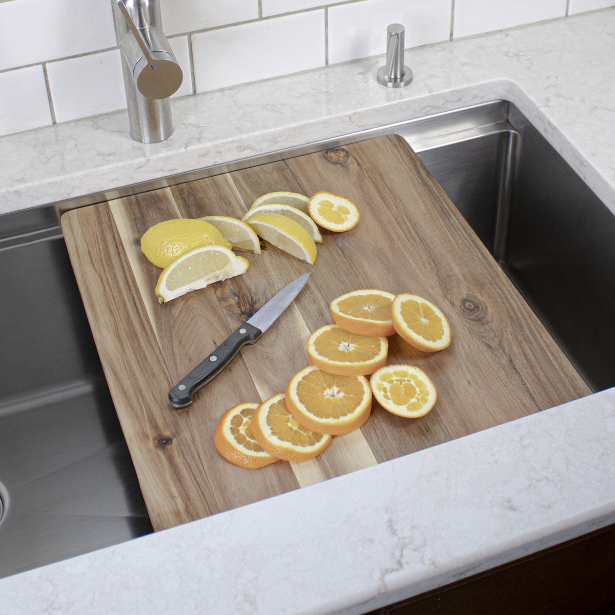 Workstation kitchen sink with edge grain cutting board