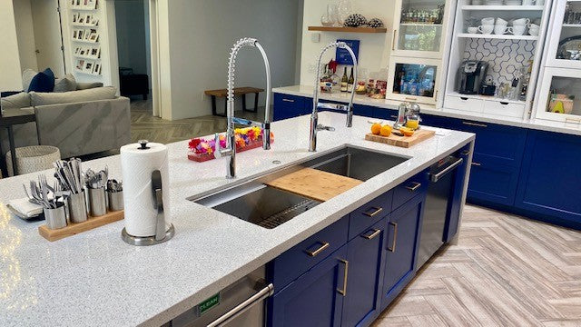 Large undermount kitchen sink in large island with two faucets