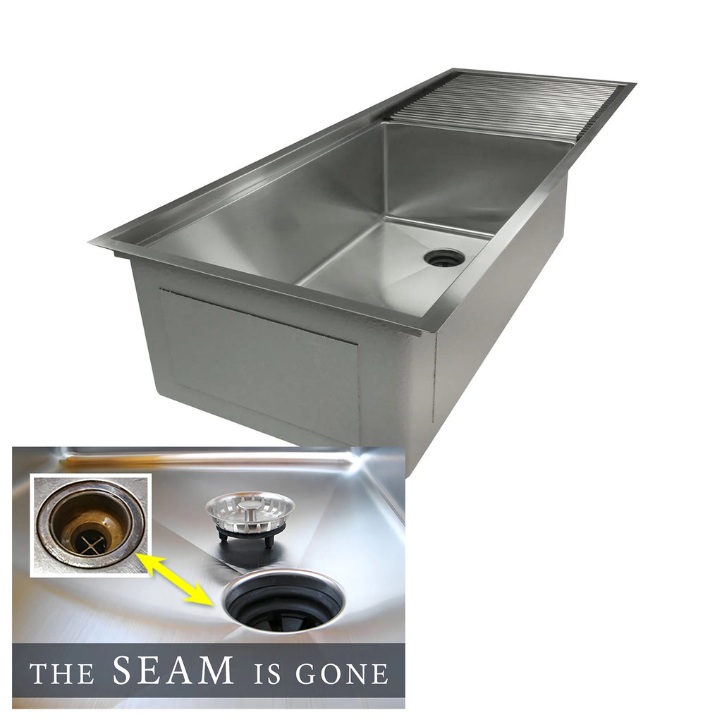 Undermount workstation kitchen sink with drainboard and center drain off to the side. The Seam is Gone.