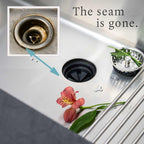 Close-up of seamless stainless steel farmhouse sink with a center drain, highlighting smooth edges and improved hygiene benefits.