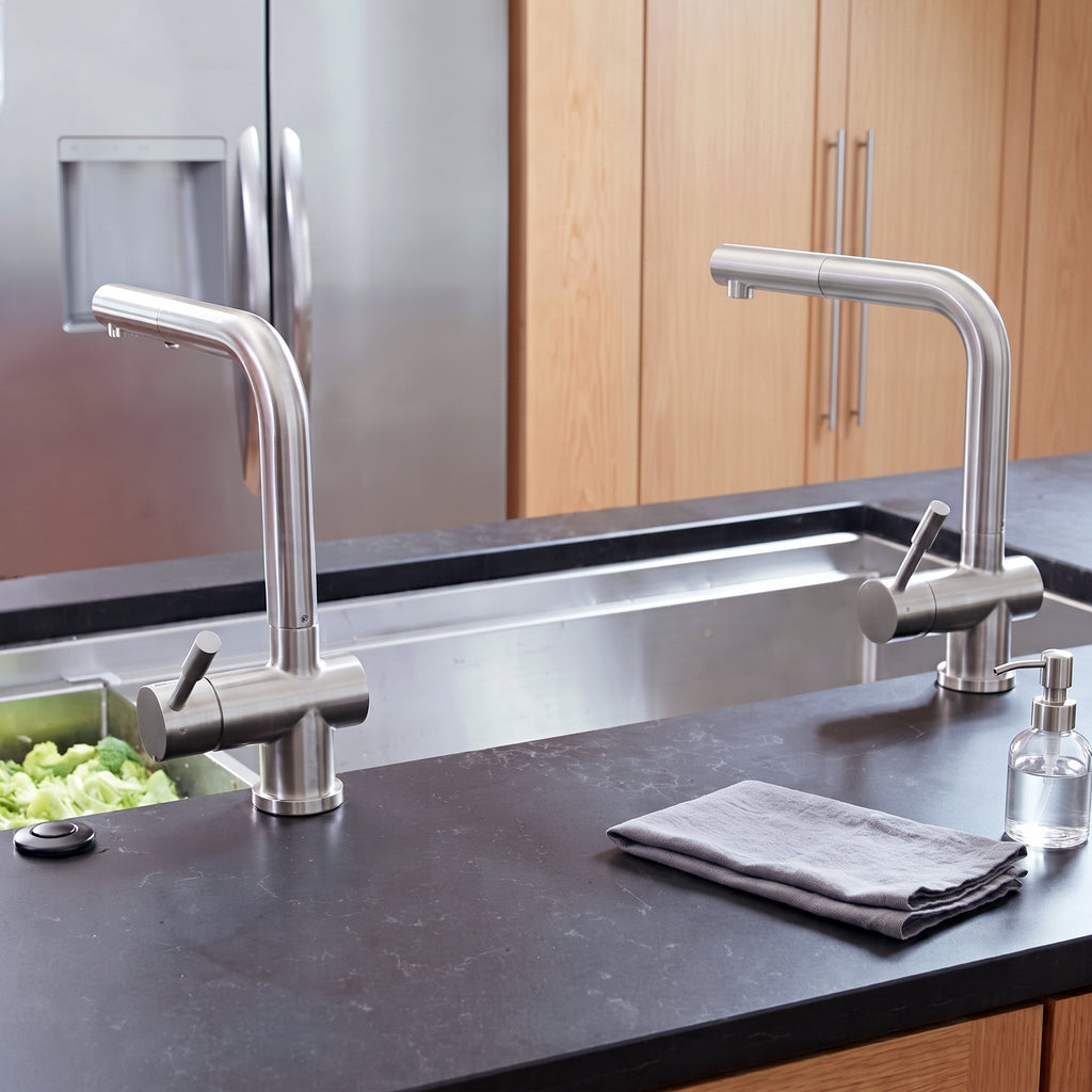Dual Ardell Stainless Steel Kitchen Faucets installed on a contemporary kitchen island sink, showcasing their modern angular design.