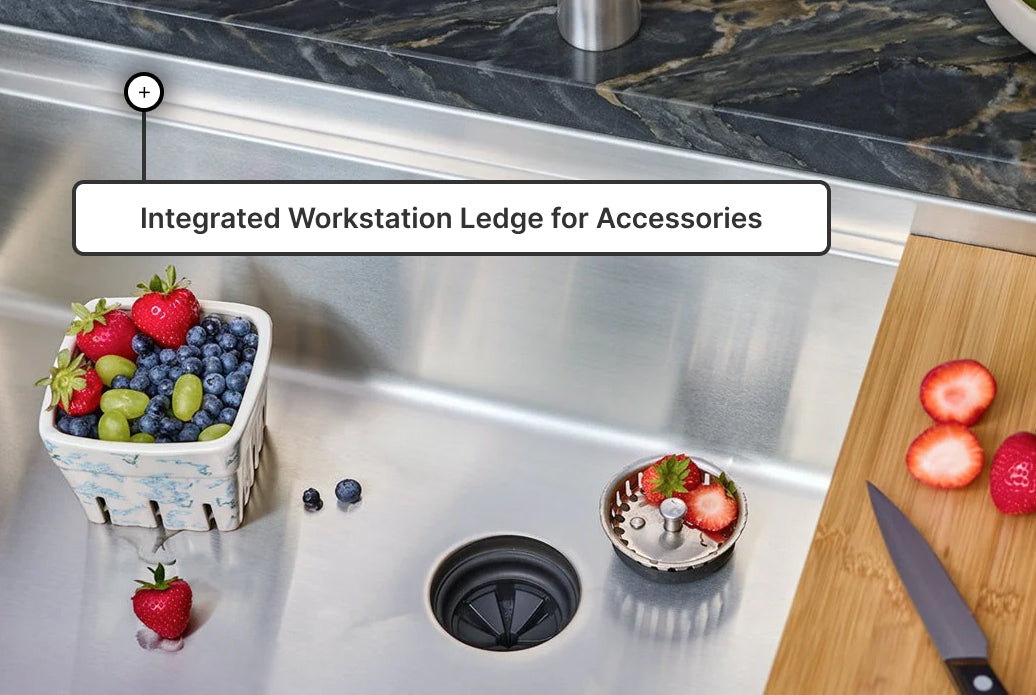 Integrated workstation ledge holding sink accessories on a stainless steel kitchen sink