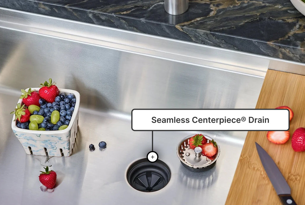 Seamless Centerpiece Drain on a stainless steel workstation sink — no seam, no leaks