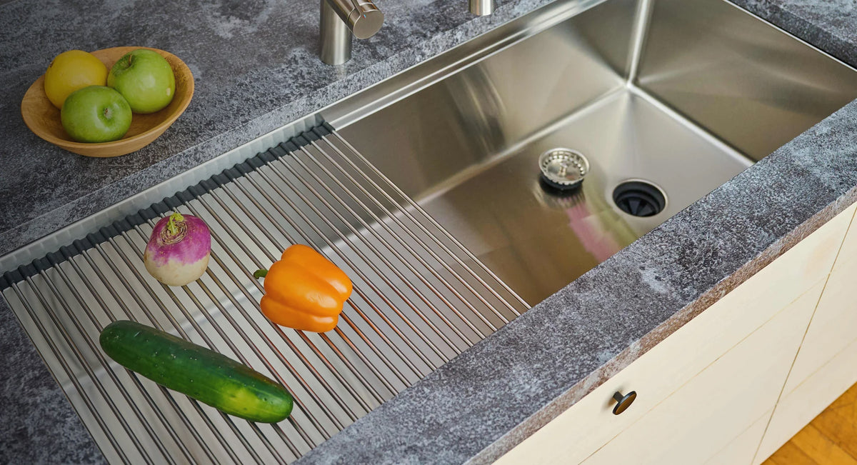Stainless steel workstation kitchen sink with an offset drain