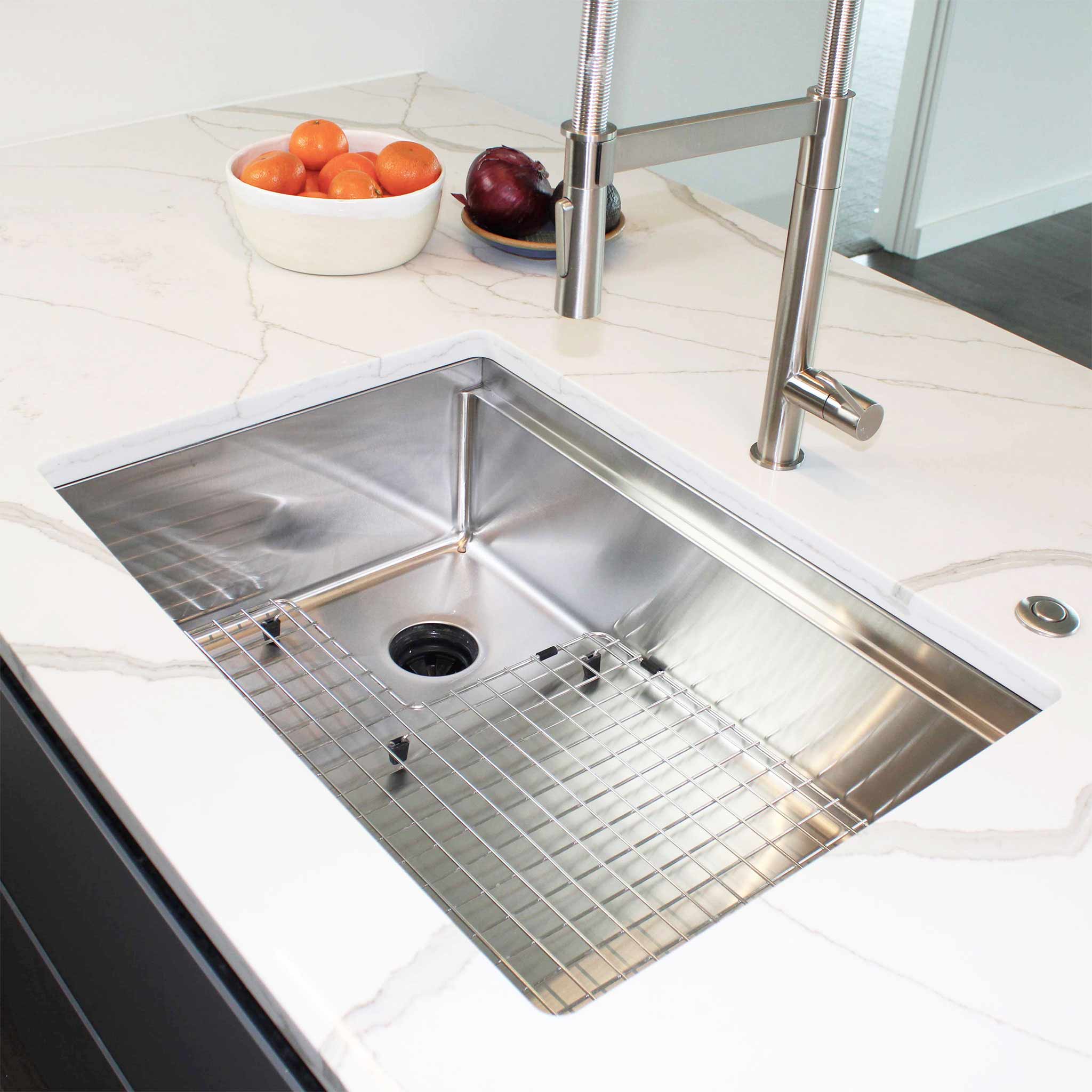 Client photo of the 28” workstation kitchen sink, made with stainless steel and a left offset drain and a seamless drain design.