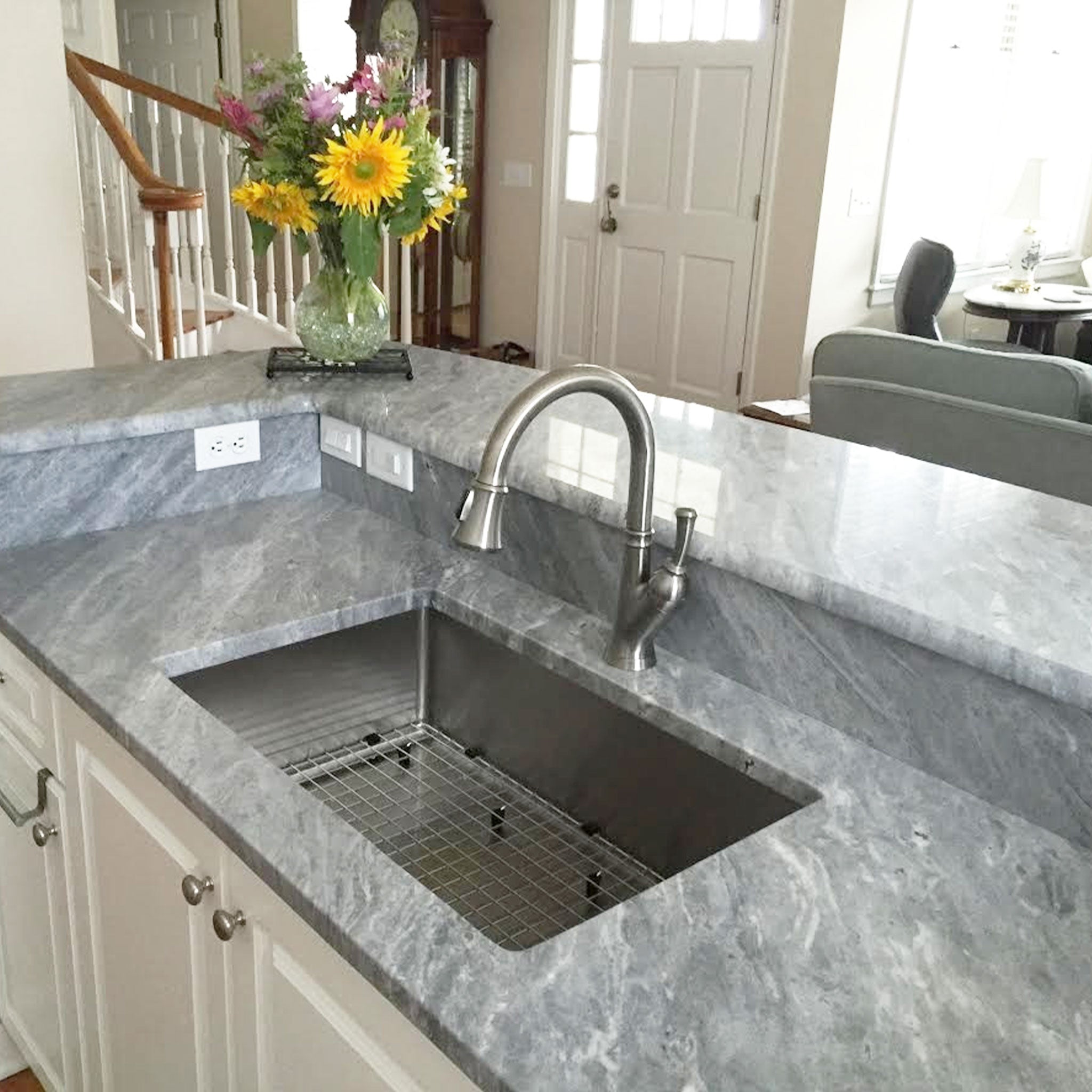 Client submitted photo of a classic, 28” kitchen sink from Create Good Sinks with a basin protecting grid.