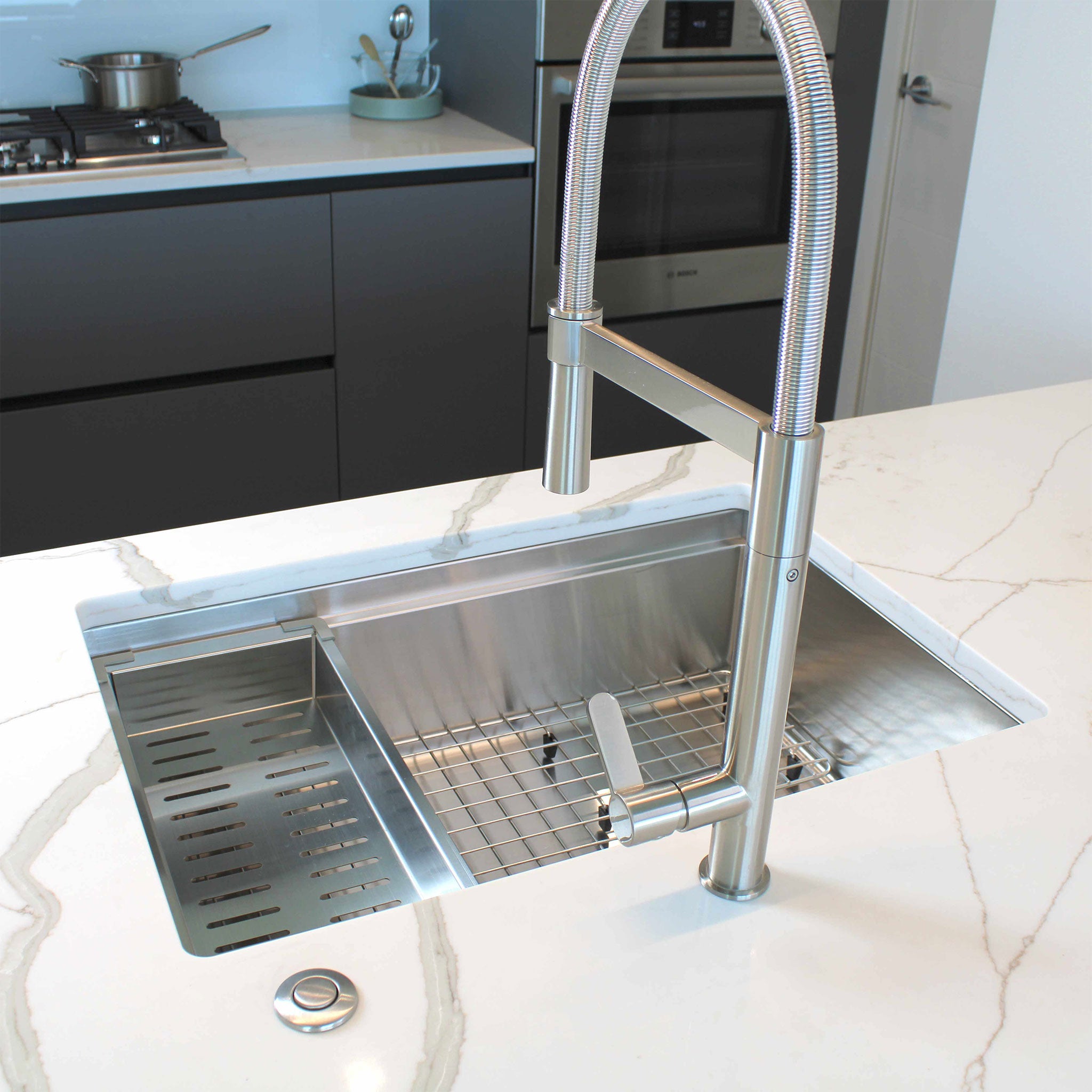 The stainless steel colander on a 28" workstation sink from Create Good Sinks and grid.