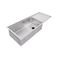 Drainboard workstation sink with reversible seamless drain