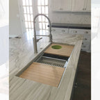 Luxury kitchen island with a 46-inch double bowl workstation sink, featuring bamboo cutting boards and a drying rack for enhanced usability.