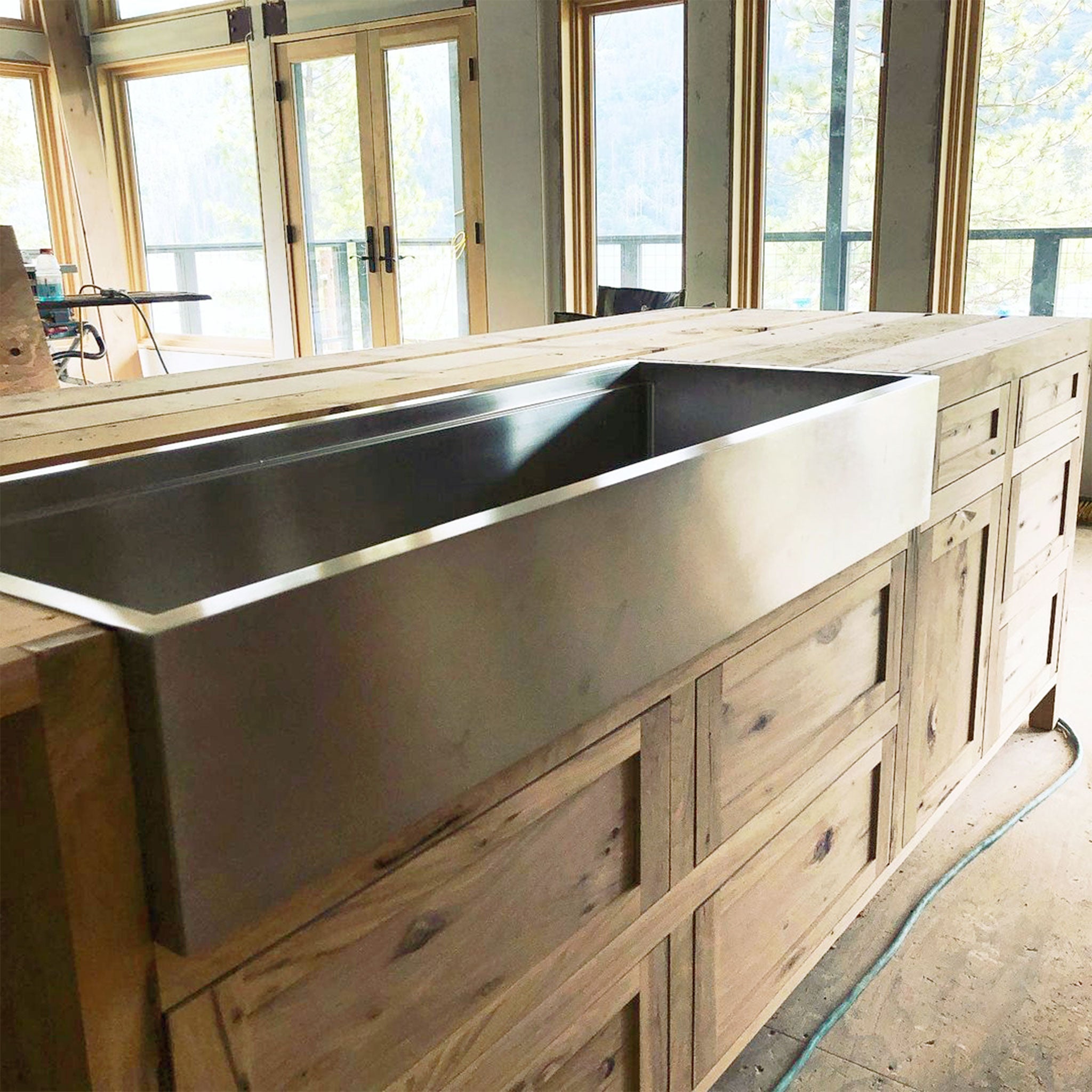 Front view of Create Good Sinks' 50" Workstation Farmhouse Sink