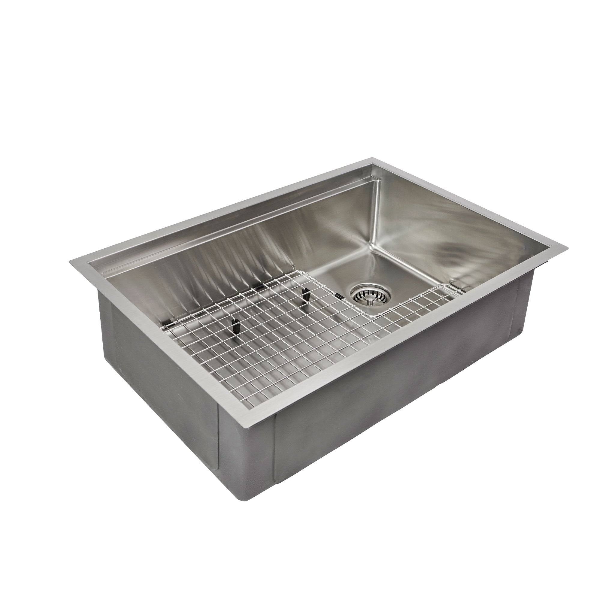 A stainless steel grid in the basin of a Create Good Sinks’ 28” workstation kitchen sink with a right, offset seamless drain.