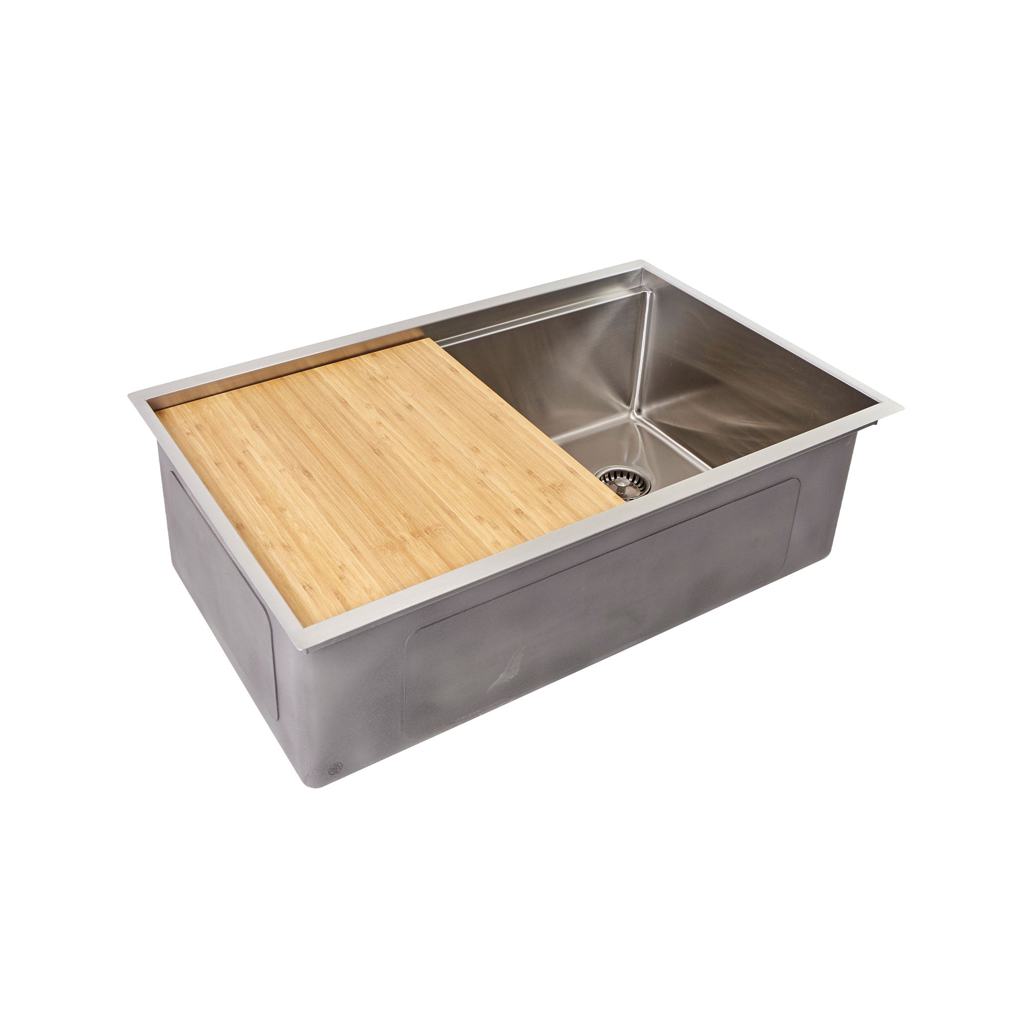 Bamboo cutting board in a 31” kitchen sink from Create Good Sinks with a right, offset seamless drain.