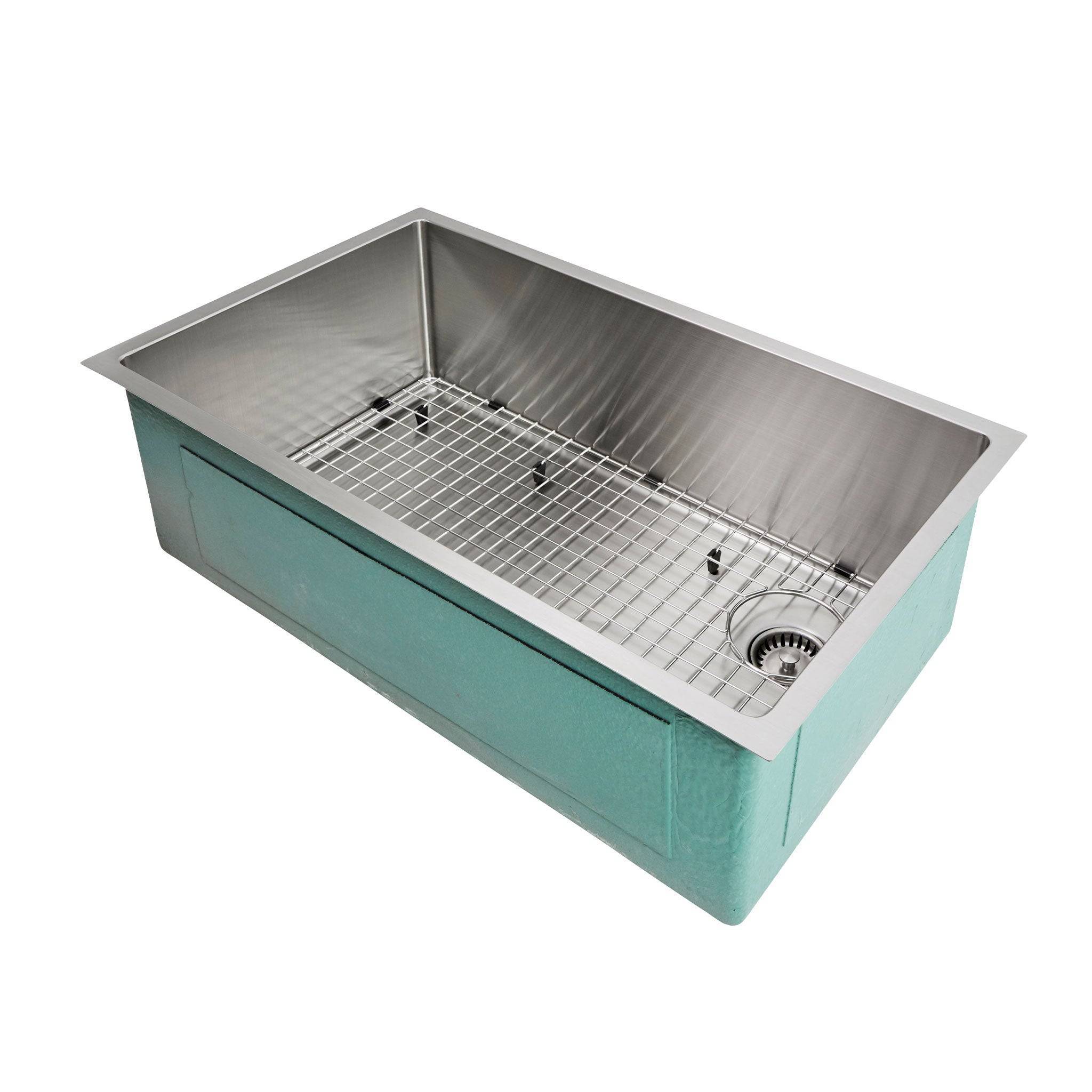 The 31” classic-style kitchen sink from Create Good Sinks with a stainless steel grid and seamless drain. Pictured is our right drain model- current model comes with offset, reversible drain for added versatility