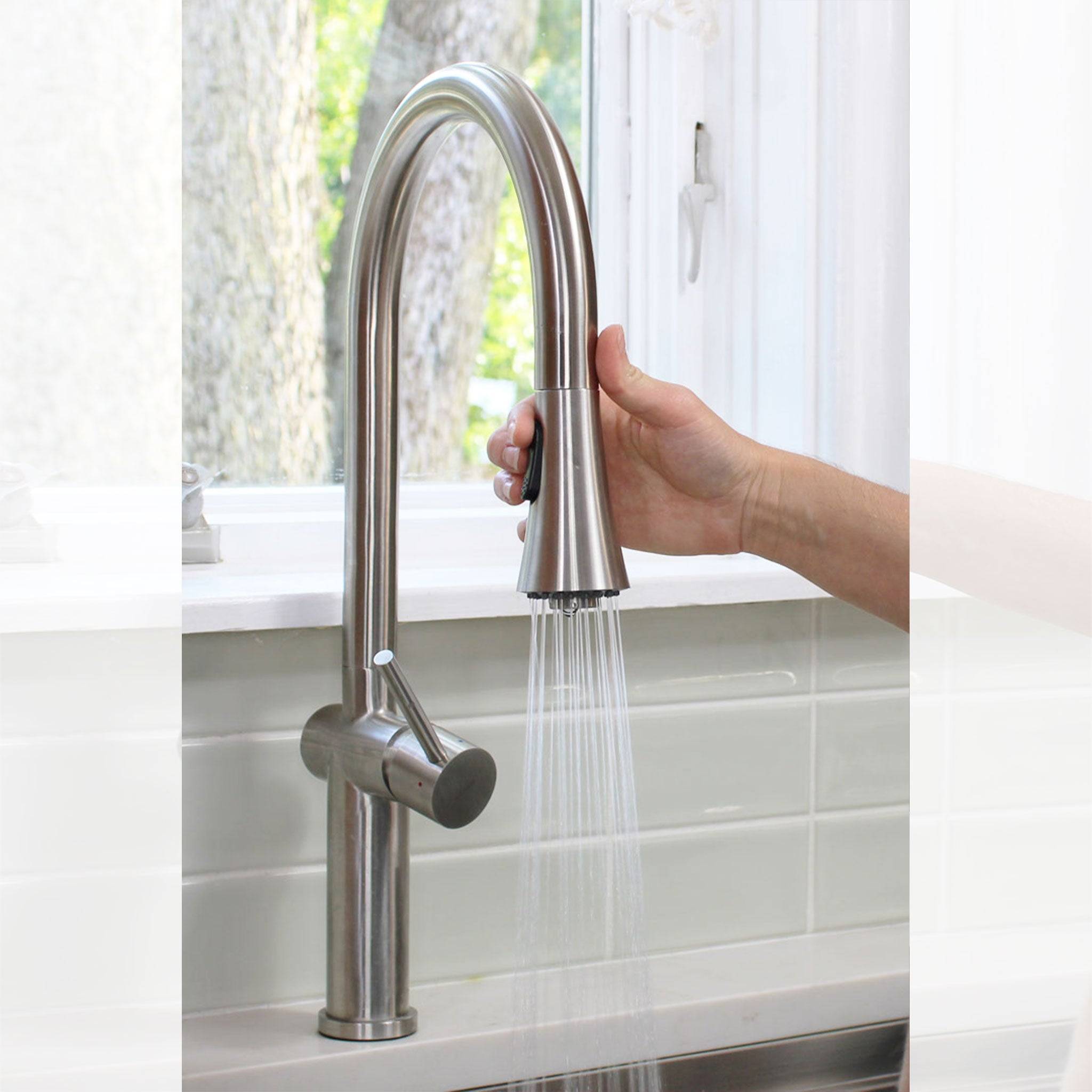 Close-up of the Bella stainless steel kitchen faucet’s pull-down spray head, demonstrating its dual spray function for versatile cleaning.