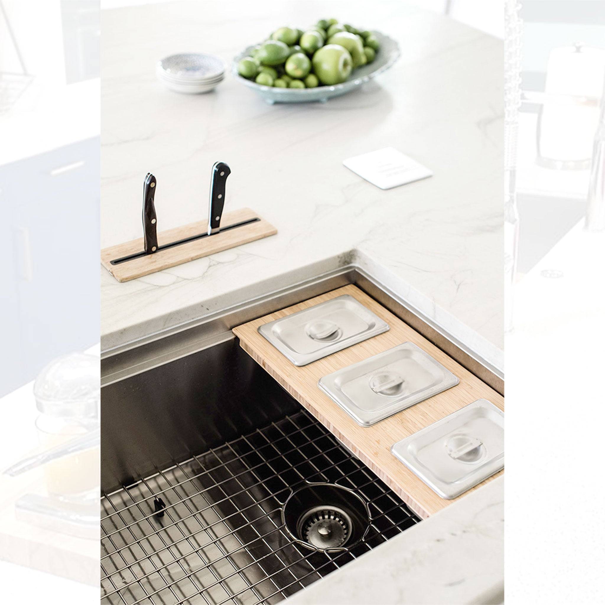 33-inch workstation sink with integrated accessories for food prep. Stainless steel single bowl design enhances kitchen efficiency and organization.