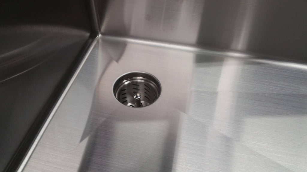 Top view of Seamless Composting Deep Drain Kit in a stainless steel sink, showcasing its sleek design and effective drainage system.