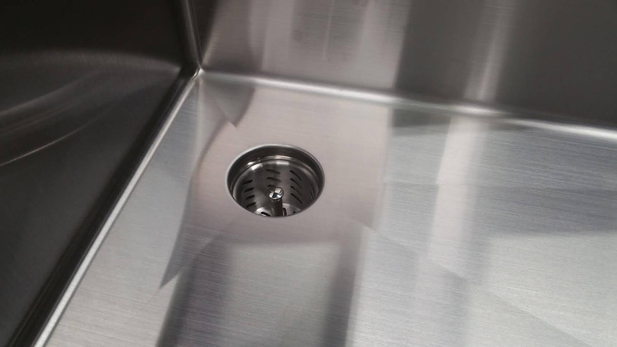 Top view of Seamless Composting Deep Drain Kit in a stainless steel sink, showcasing its sleek design and effective drainage system.