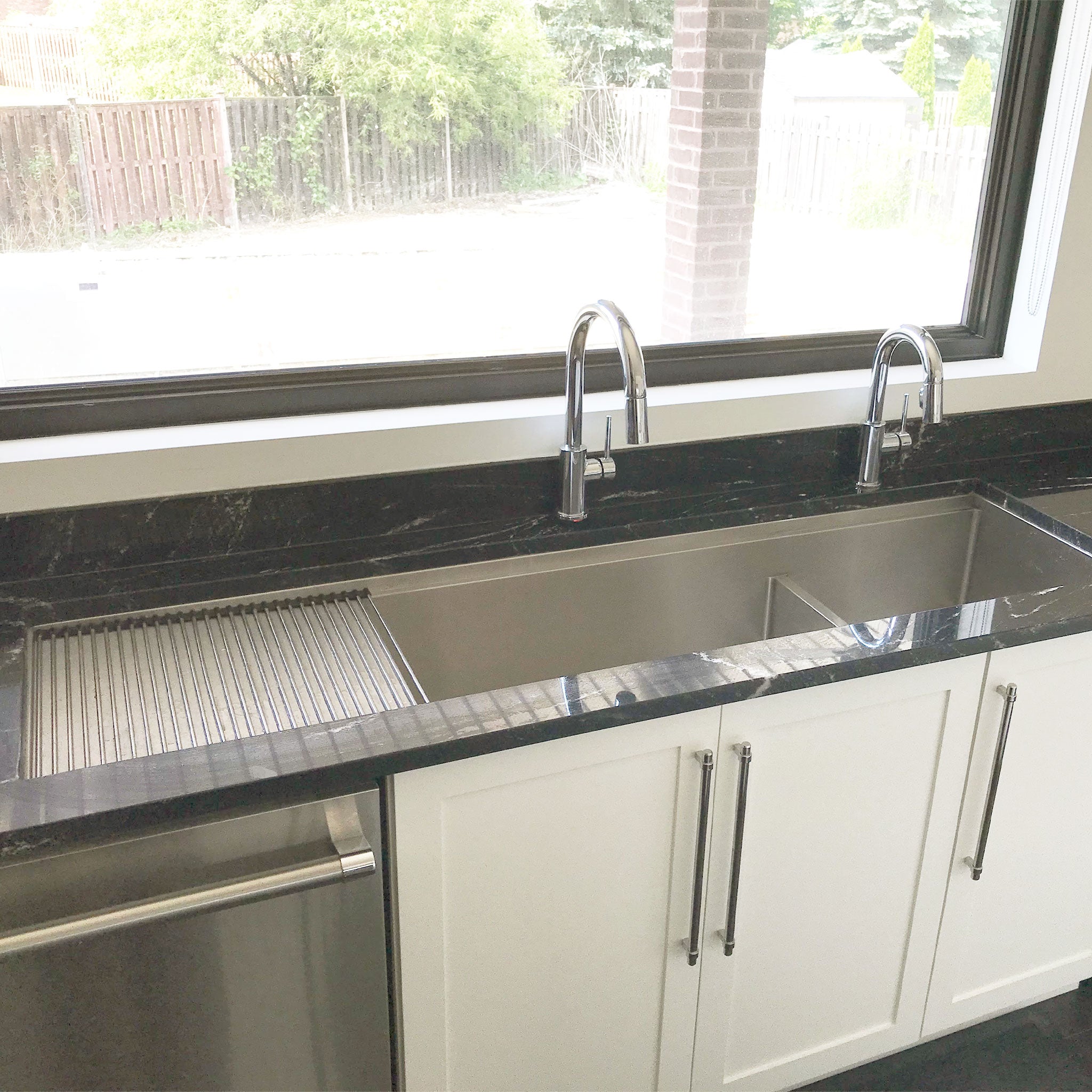 Oversized 68” stainless steel workstation kitchen sink with twin basins and a drainboard