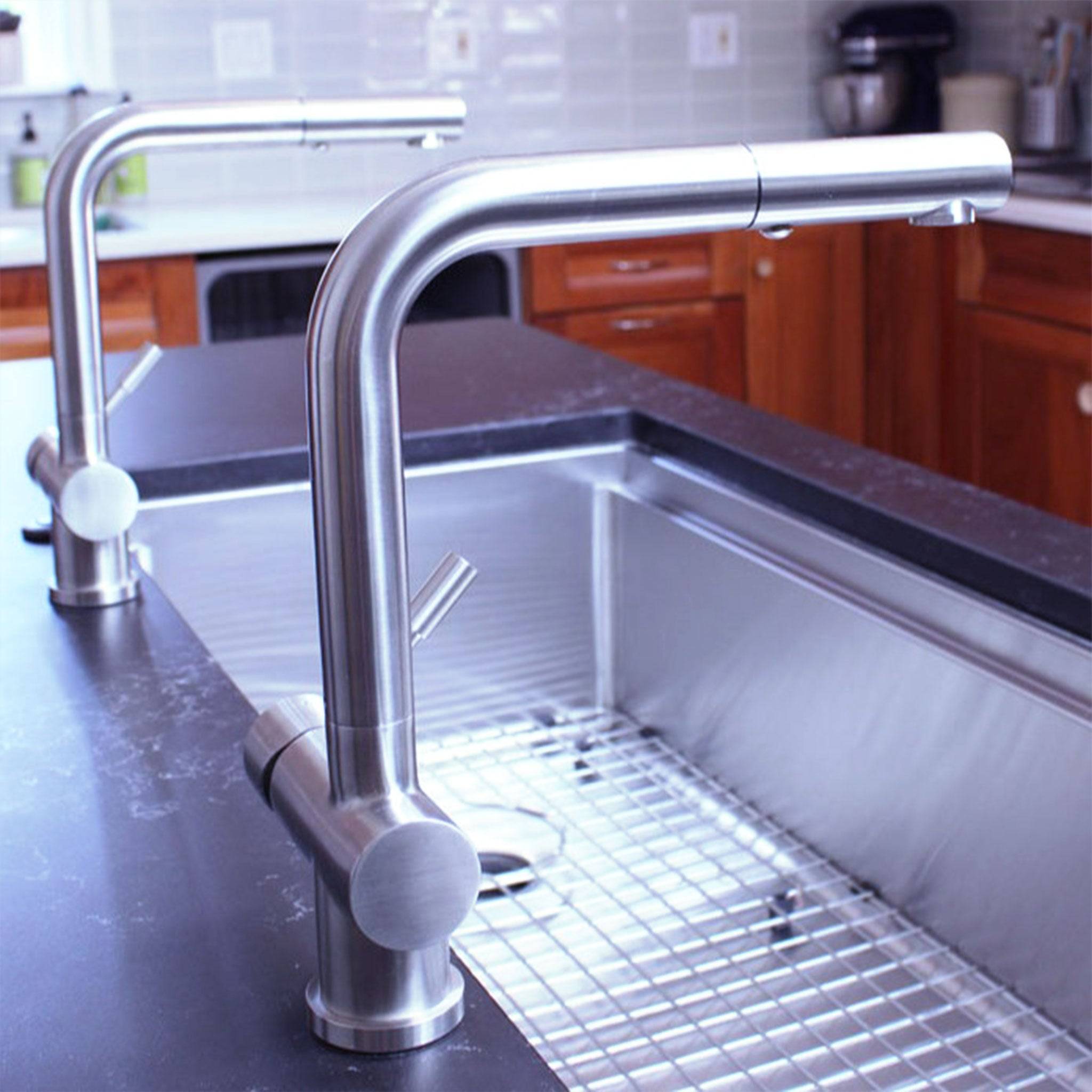Pair of Ardell Stainless Steel Kitchen Faucets installed on a stylish kitchen sink, highlighting their modern design and durable finish.