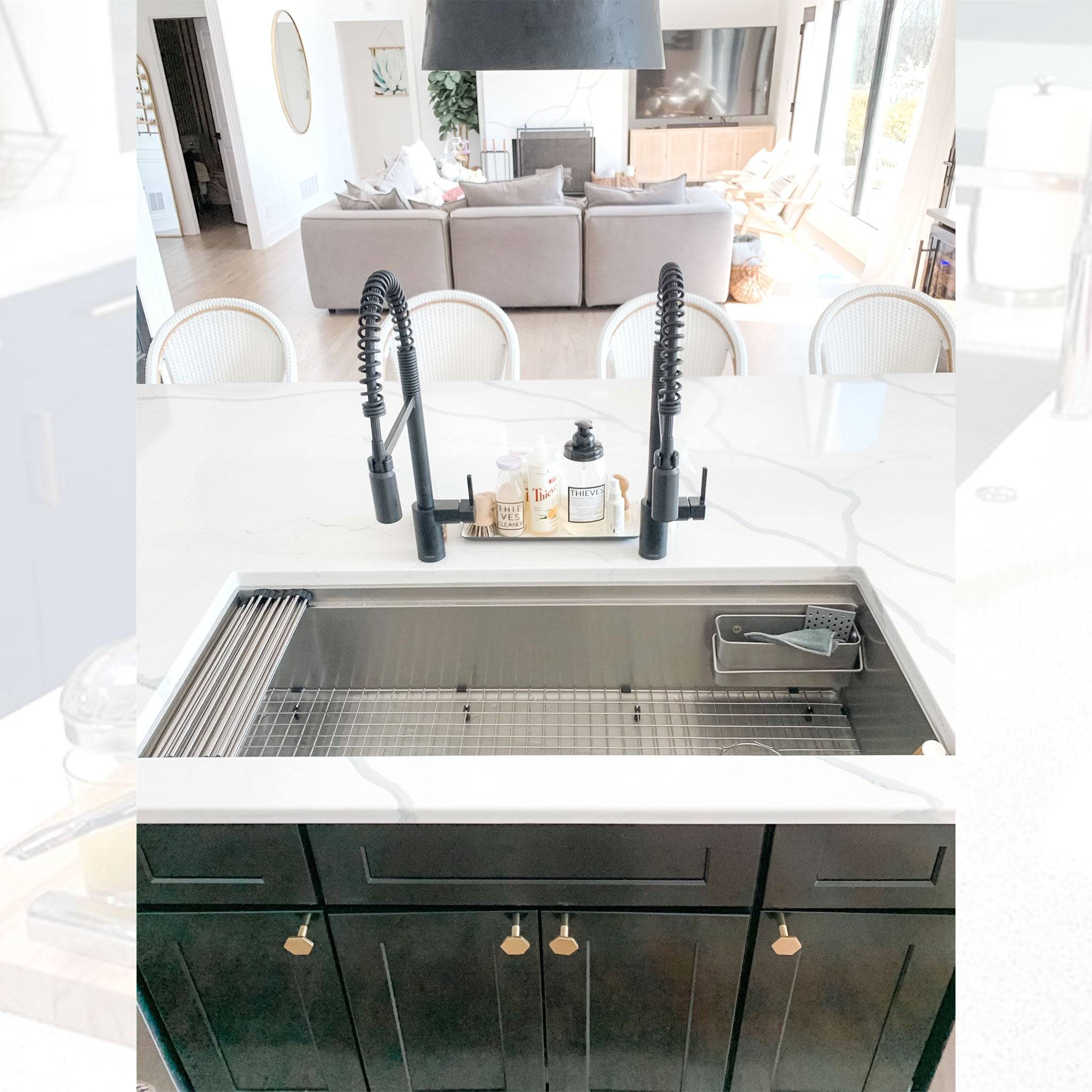 Spacious 46-inch workstation kitchen sink with dual faucets, stainless steel grid, and a sleek modern design for high-end kitchens.