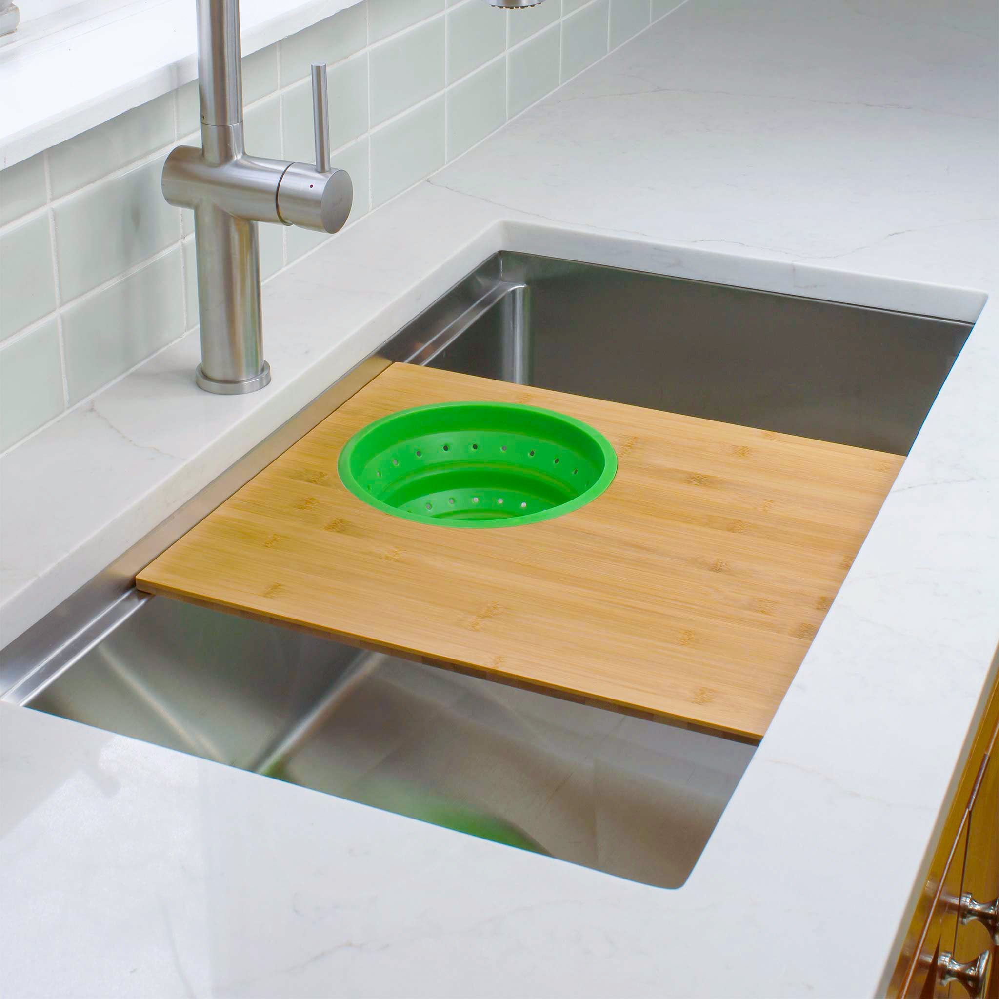 Seamless drain workstation sink with cutting board and silicone colander in fresh green from Create Good Sinks