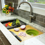 33-inch workstation sink with cutting board and colander accessories. Stainless steel single bowl design enhances food prep and cleanup efficiency.